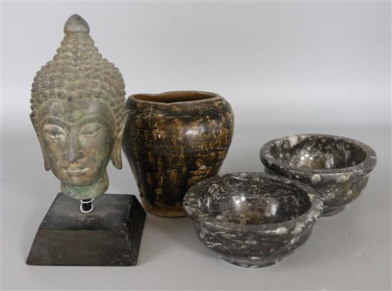 A Cambodian pottery vase, a bronze Buddhas head & two fossil stone bowls